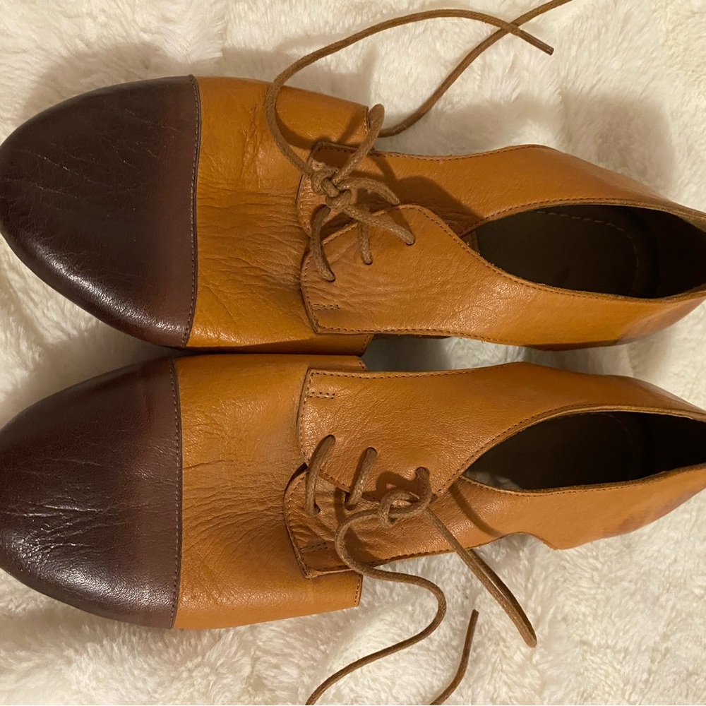 Laced Bueno Shoes with side cut out. Brand new.